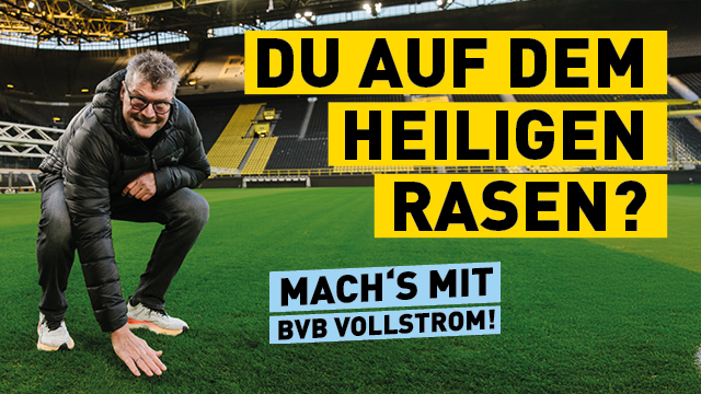 Norbert Dickel im Bvb Stadion auf dem Rasen, schriftzug machs mit BVB vollstrom